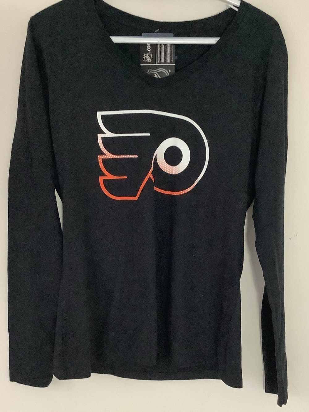 NHL Black Women's Long-Sleeve Tee with Orange Accent Logo